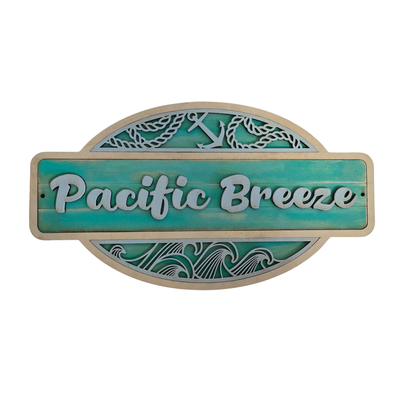 Decorative sign with 'Pacific Breeze' text on a teal background